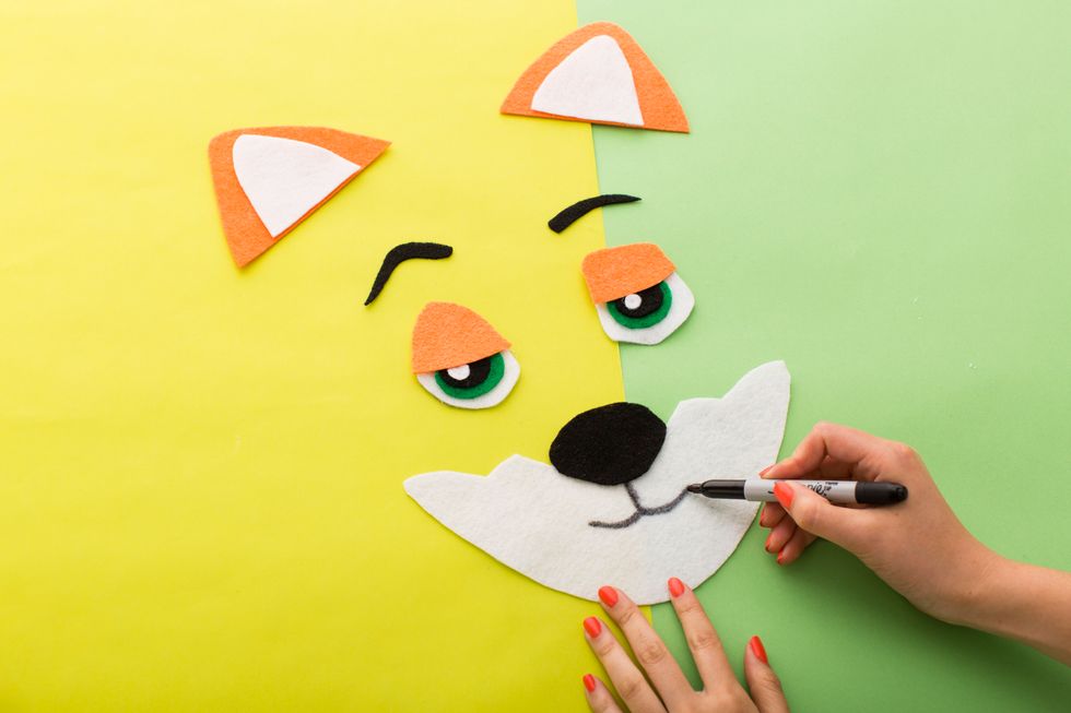 Be sure to draw his mouth with a thick black pen.