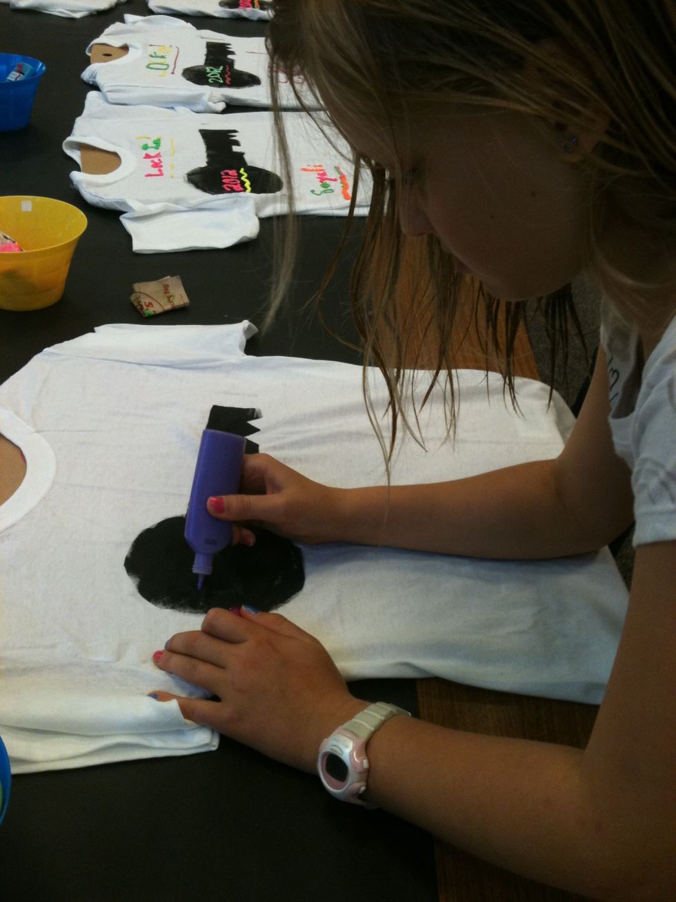 Be sure to not squeeze the paint too hard. Under the key write your name and in the big part of the key put the year. On top of the key put "LOCK IN".