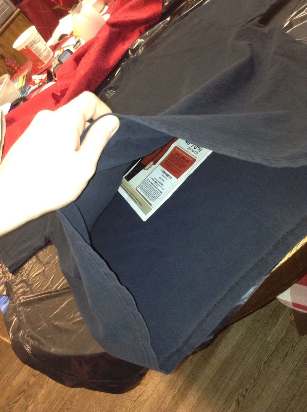 Be sure to put old newspaper INside the shirt to prevent bleach from going through.