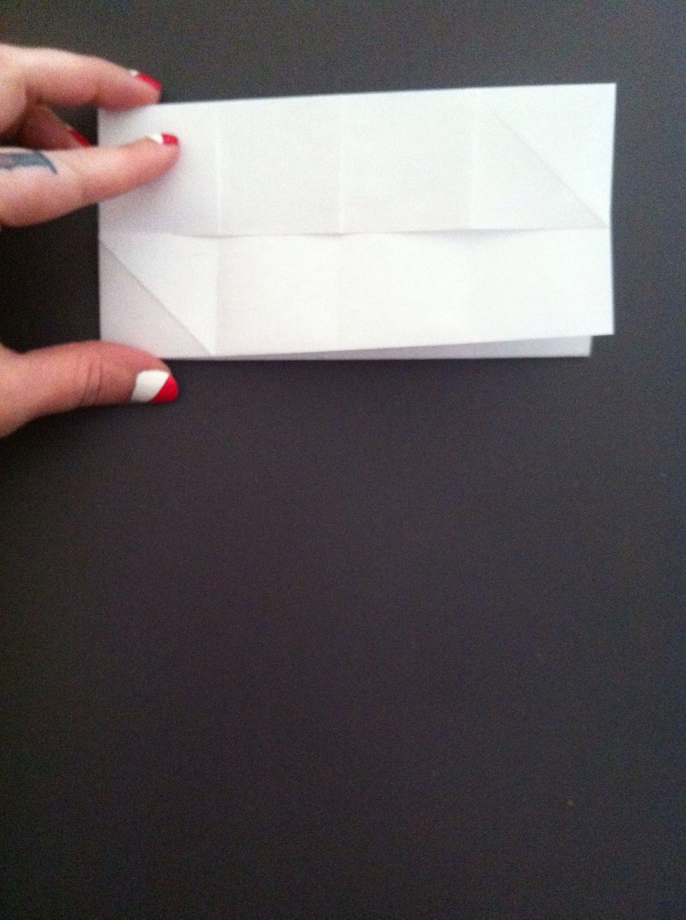 Be sure you folded in half the correct way; you should have raw edge of paper in middle like this.