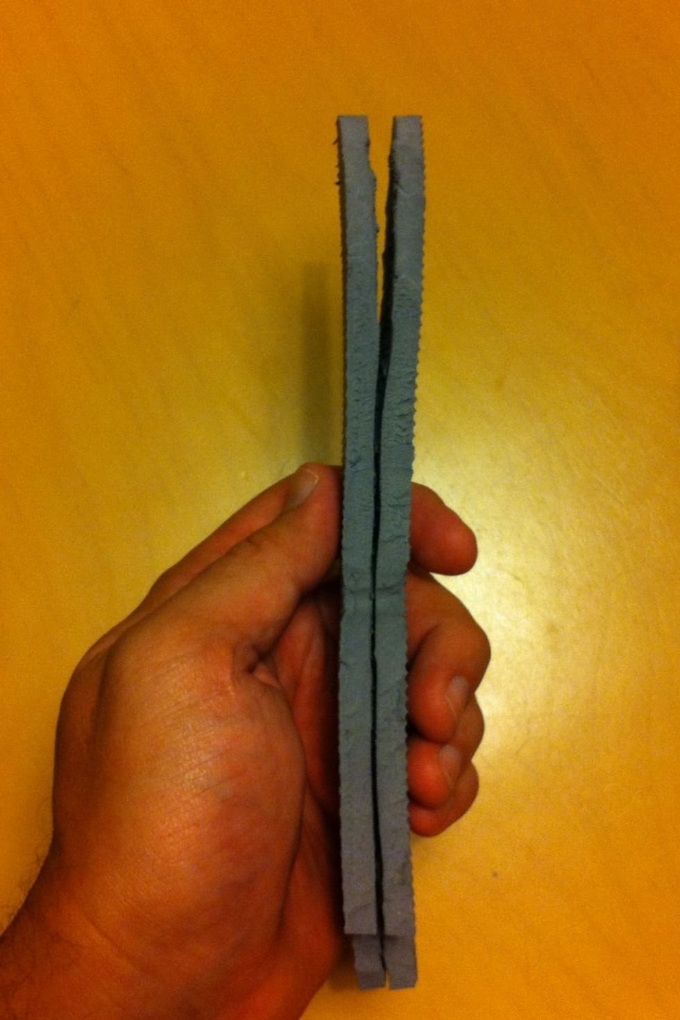 BE VERY CAREFUL: Use the x-acto knife to split the material evenly. Point the blade UP, and cut AWAY from your body, poking into the material, and slicing up and away from your hand in short strokes.