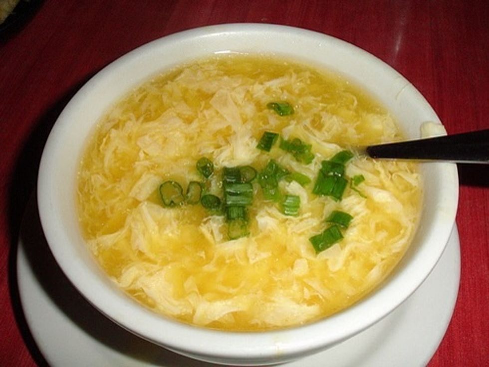 Beat 2 eggs and while stirring, slowly add to broth until eggs look like ribbons