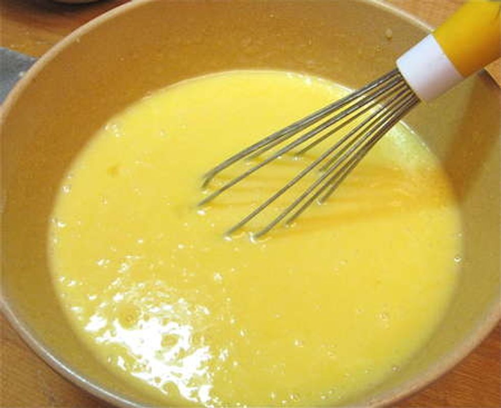 Beat 2 eggs in separate bowl. Then cook in a small pan. Eggs need to be scrambled. Once scrambled, they can be added to the mixture.