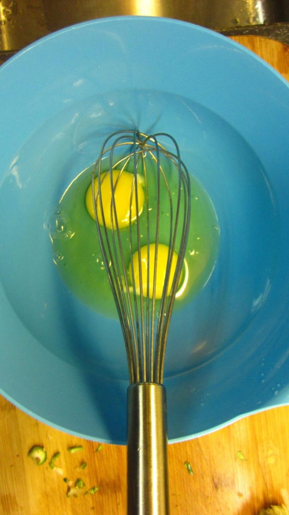 Beat 4 eggs with a whisk. Yes we know the picture only shows 2 eggs, but you are going to need 4 eggs for double coating the cutlets with the bread crumbs.