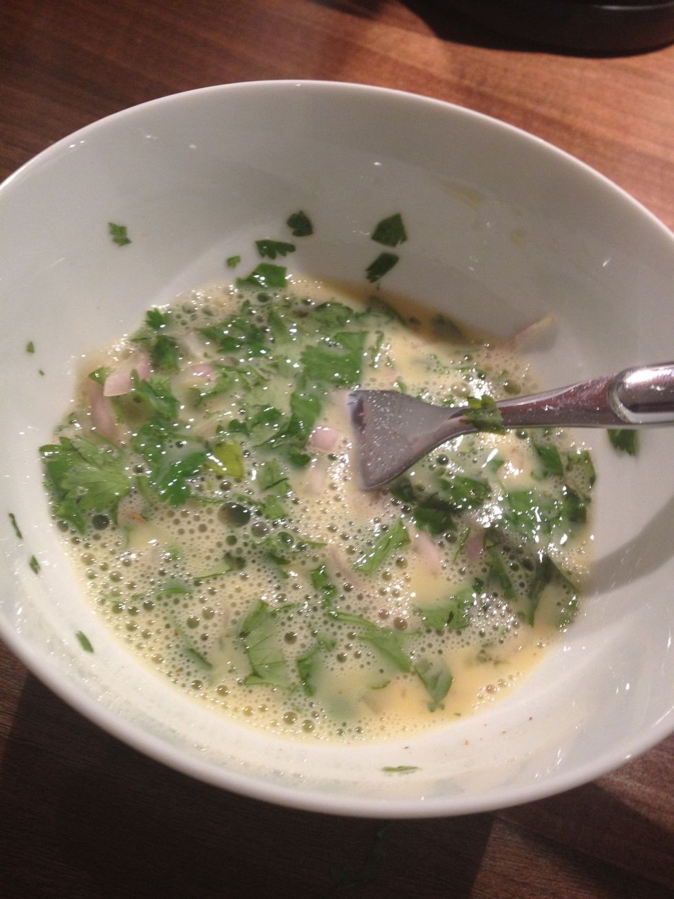 Beat an egg, add a splash of milk. Then mix with your coriander and onion. Add a pinch of salt.