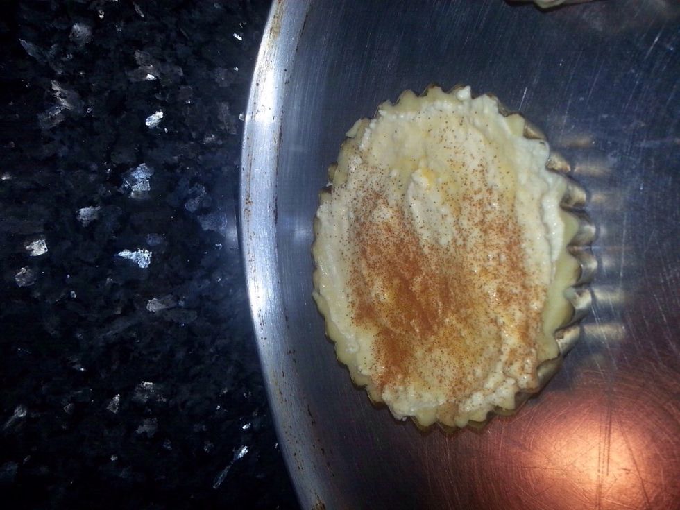 Beat an egg and brush a bit of it on top of the cheese so when cooking it turns into a nice golden colour, also sprinkle cinnamon on top