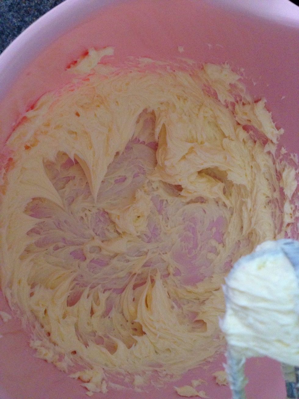 Beat butter till soft and fluffy.