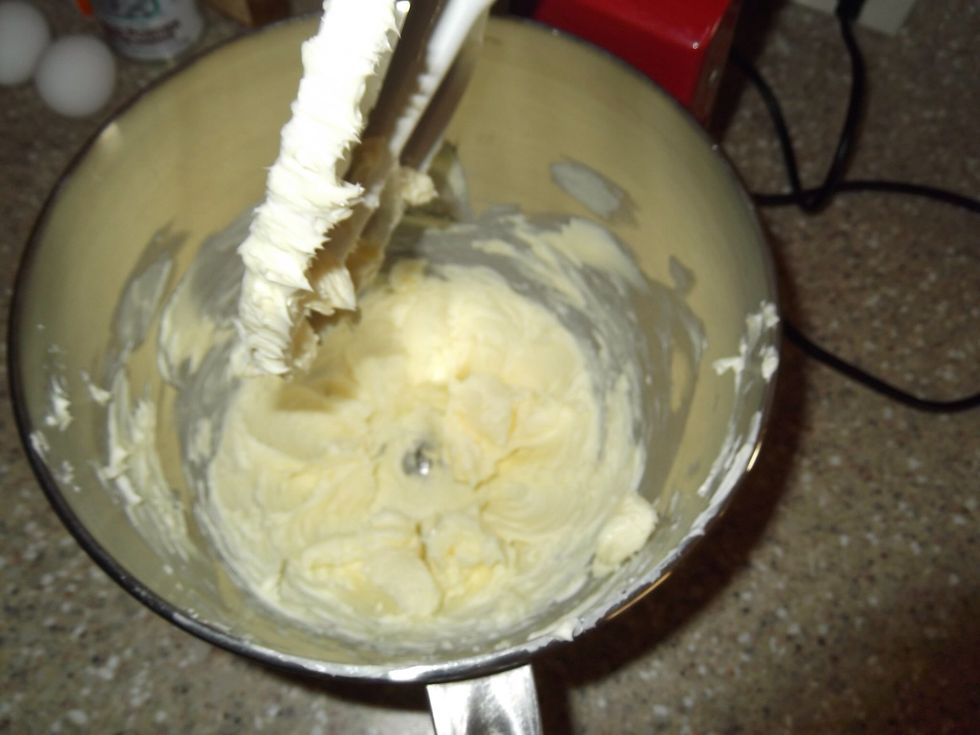 Beat butter till soft.
