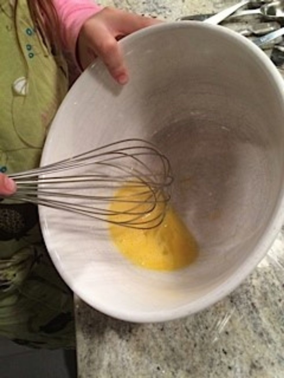 Beat egg until frothy.