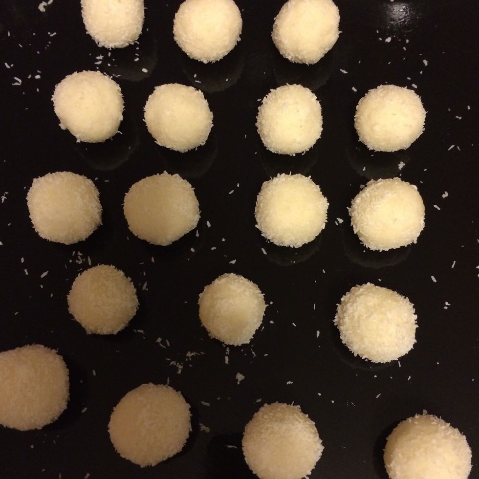 Beat egg whites with a pinch of salt, after high peaks, start adding sugar (3/4 cups) while still beating. Add flour (4spoons), then add 0.5lbs of coconut flakes. Mix w hands. Form balls. Bake at 325F