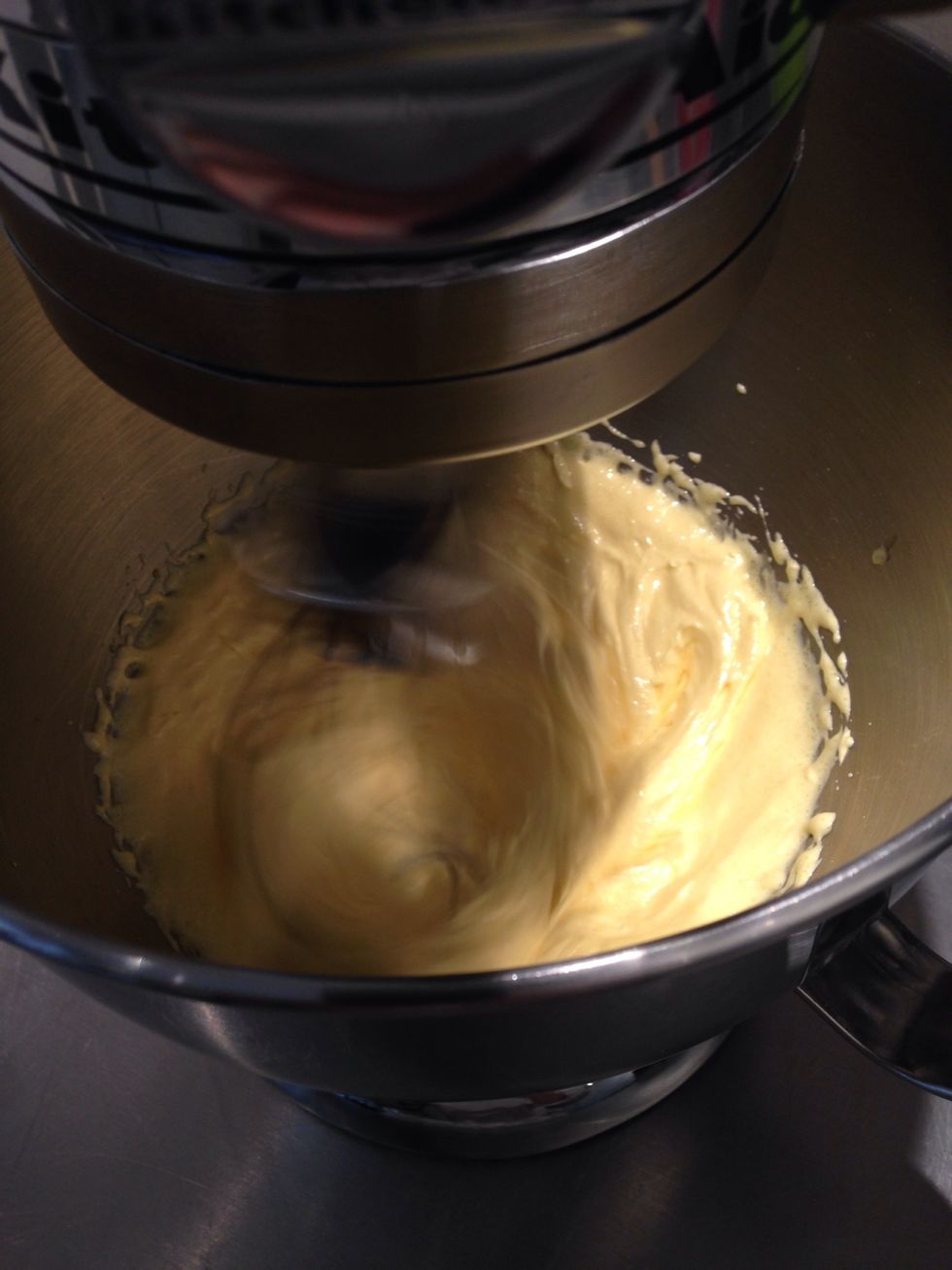 Beat egg yolks with the sugar untill white and fluffy add the corn flour and the vanilla extract