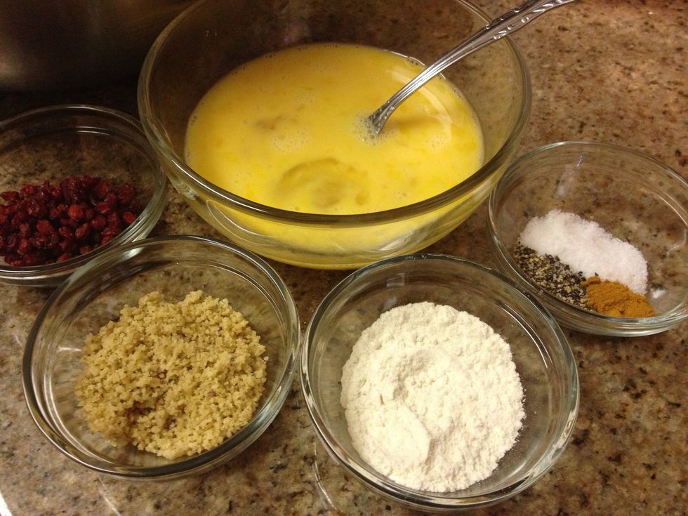 Beat eggs and gather other ingredients. The red berries are called "zereshk" and are barberries, they're tart and sweet, if unavailable you can sub dried cranberries for them.