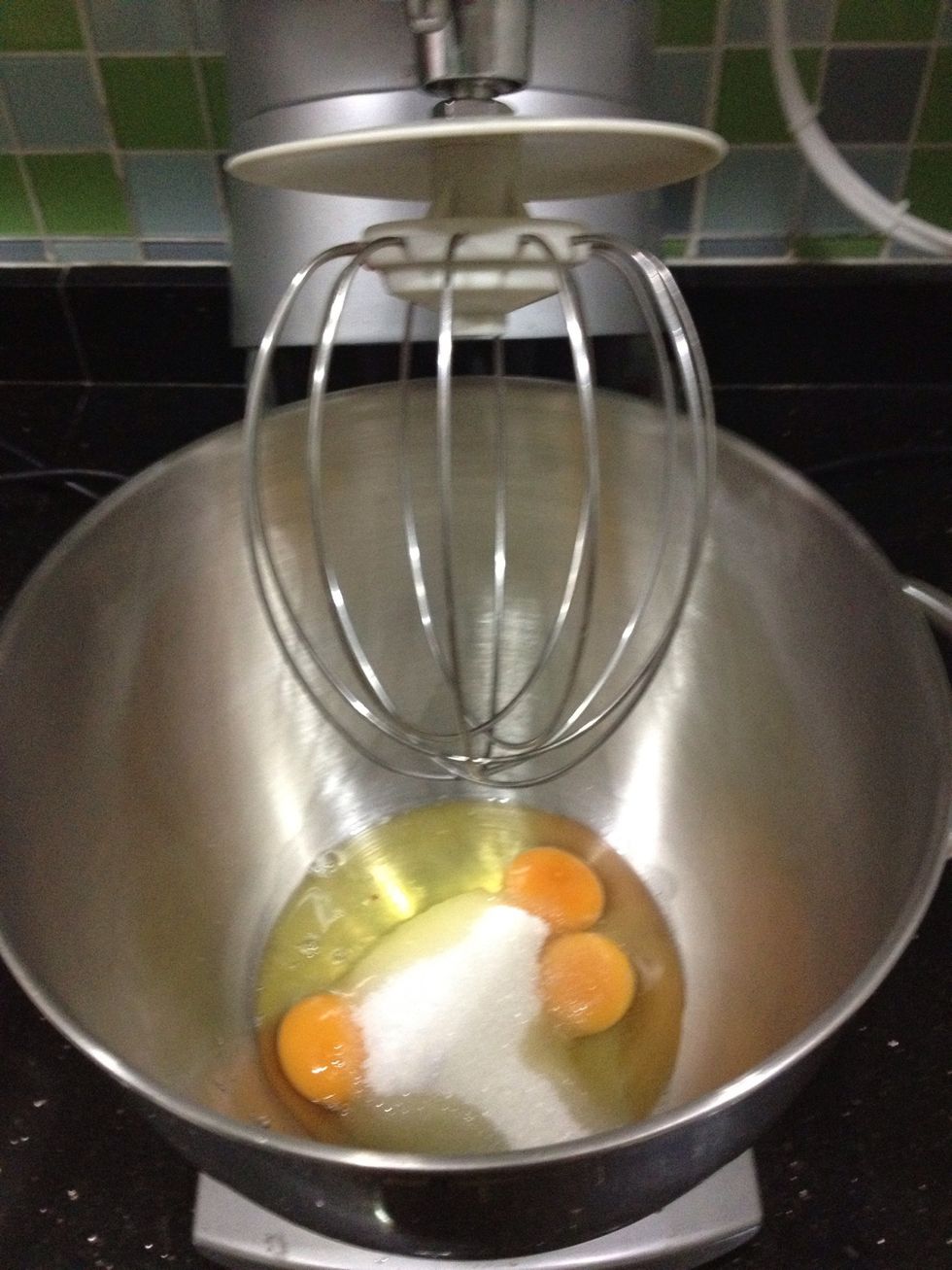 Beat eggs and sugar in your mixing bowl with the whisk attachment for 5 minutes or until sugar is dissolved and mixture is thick and creamy.