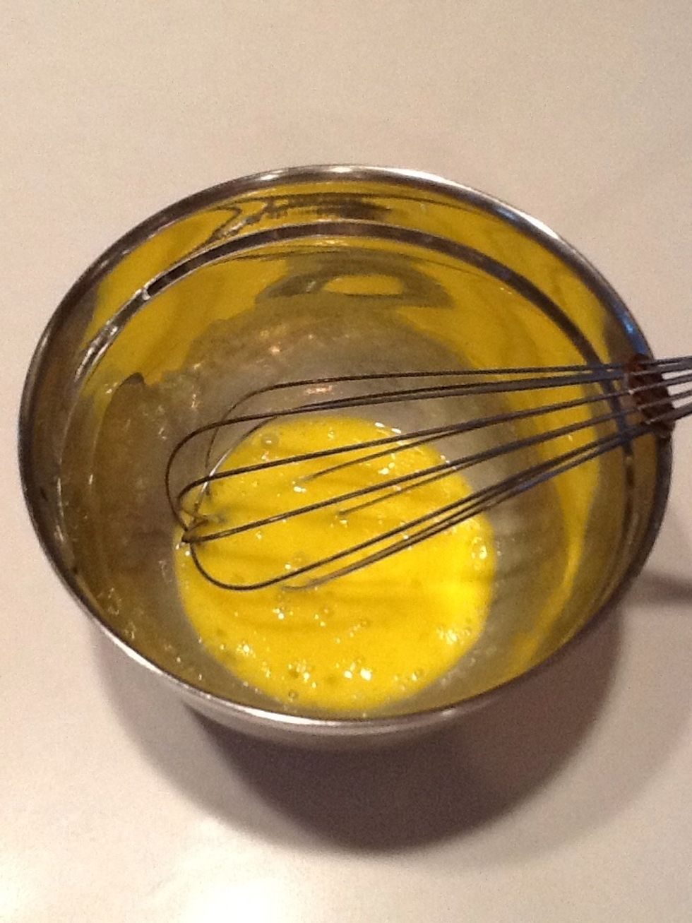 Beat eggs with a whisk.