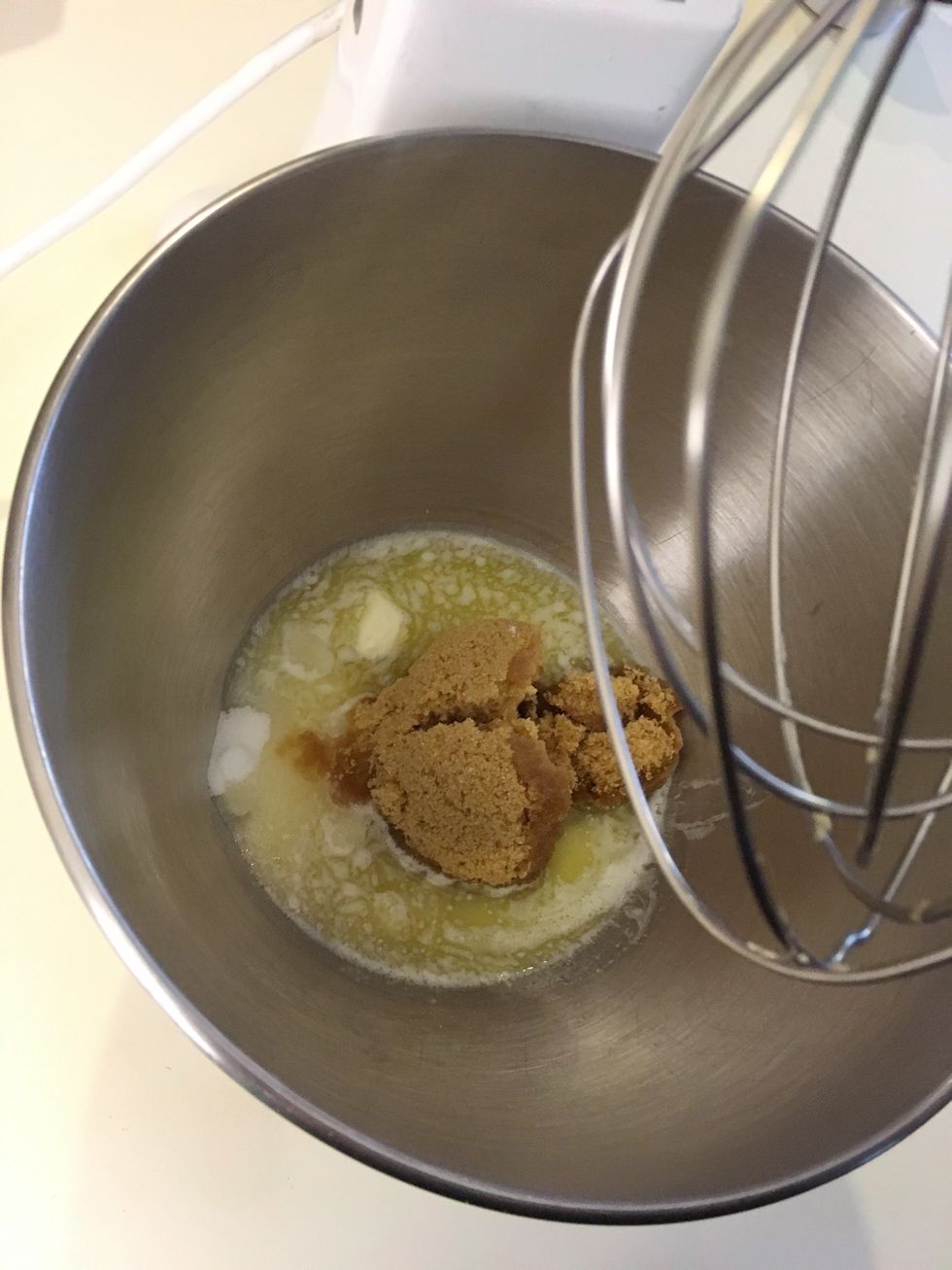 Beat granulated sugar, brown sugar, and softened butter in a stand mixer.