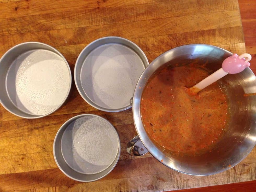 Beat in dry ingredients, and add carrots and raisins, and cranberries, stir with a spoon. Spry 2, 7 inch pans with nonstick cooking spray.