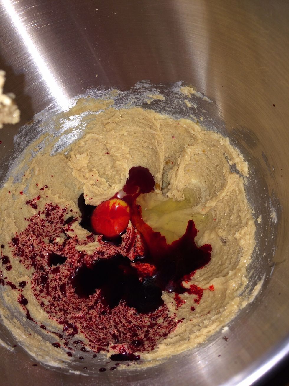 Beat in egg, vanilla extract and food coloring