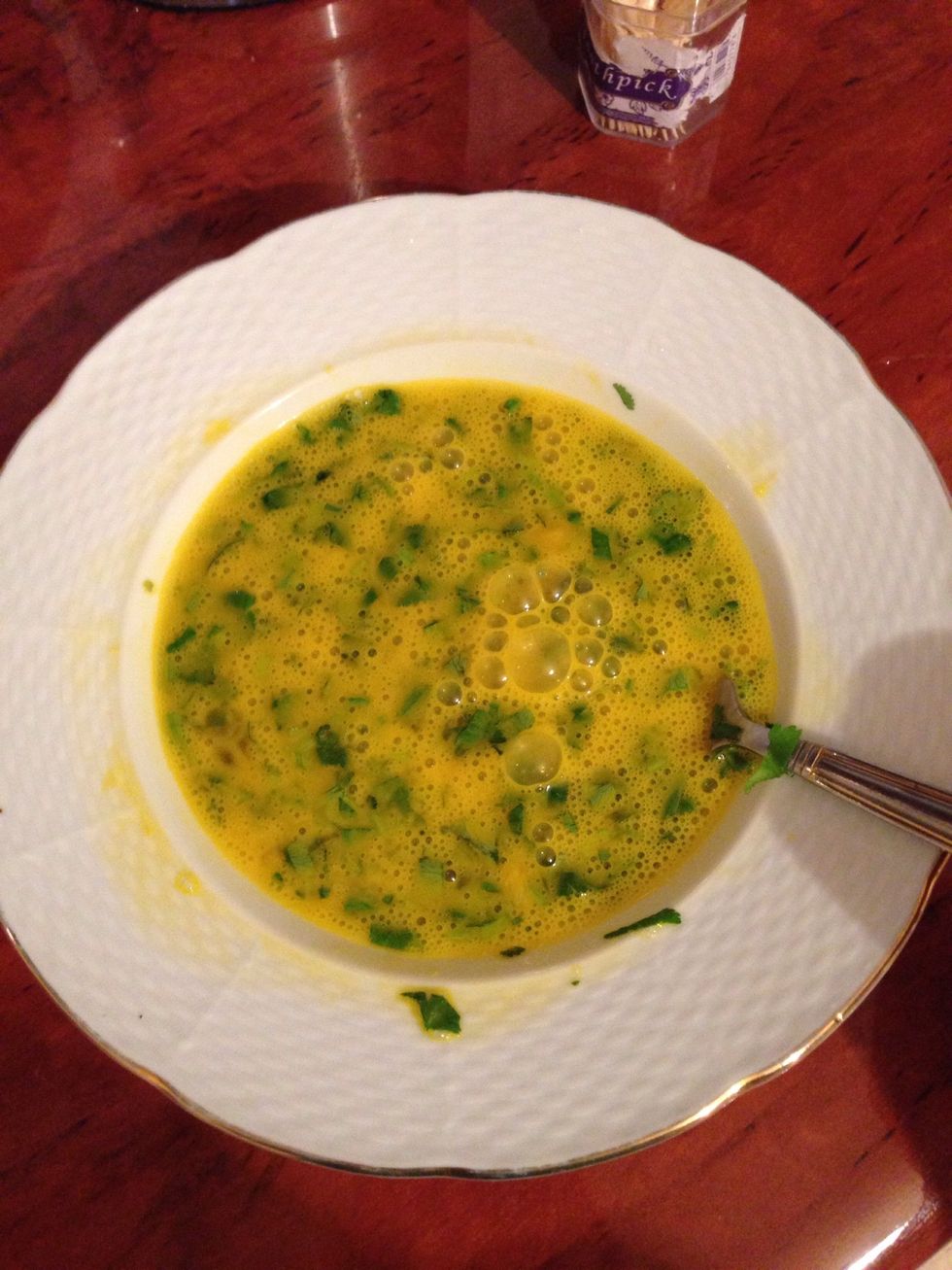 Beat in the eggs, add the chopped parsley into the egg mixture, but keep a tiny bit for garnishing
