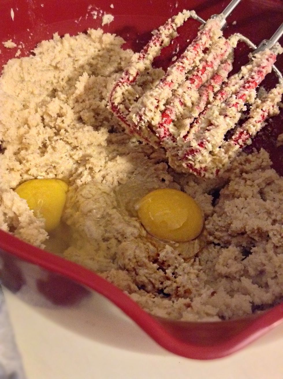 Beat in the eggs and 2 teaspoons of vanilla until combined.