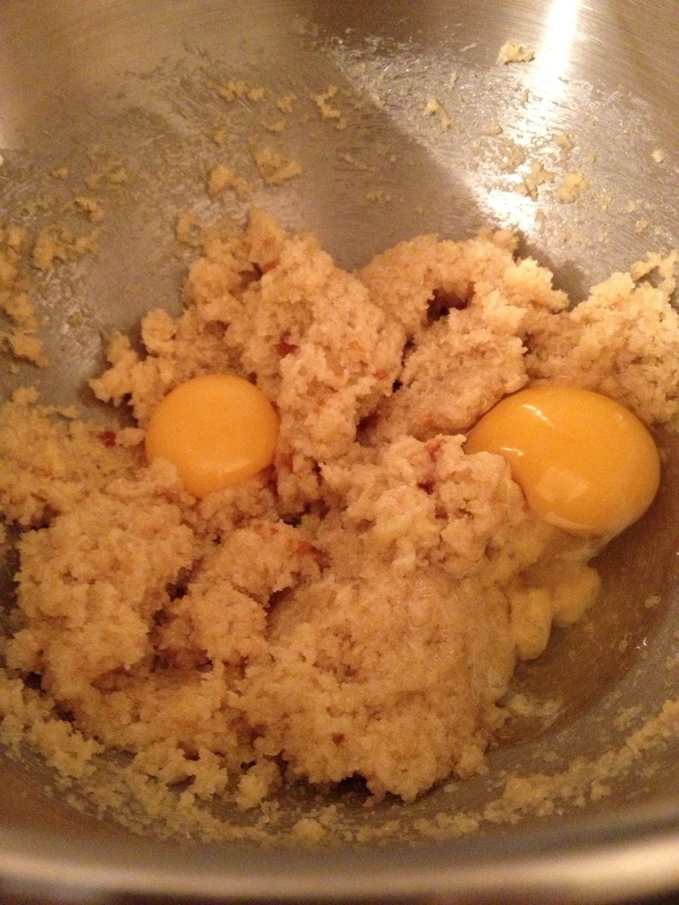 Beat in the vanilla, egg, and egg yolk until light and creamy.