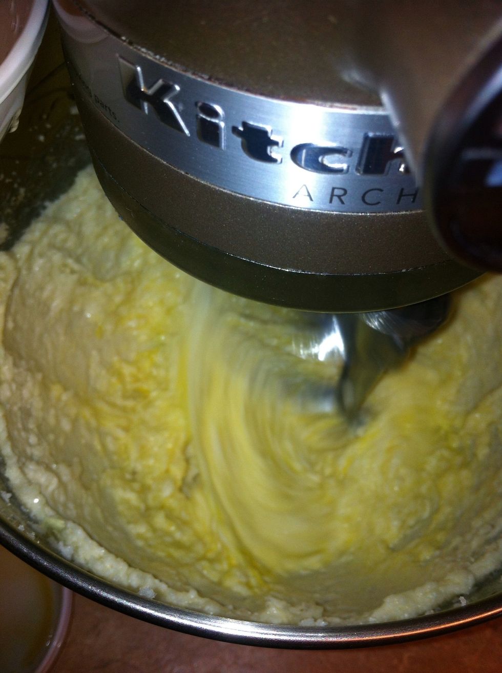 Beat in vanilla, then eggs one at a time, until combined, about 30 seconds. Scrape down beaters and bowl as needed.