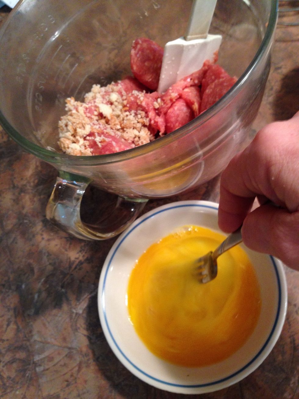 Beat raw eggs before adding to meat and crumbs....