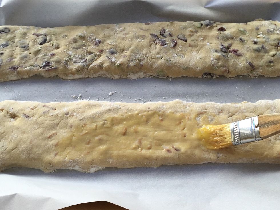 Beat remaining egg and brush on top of the dough logs. (Note: pictured are two biscotti flavors: cranberry-pistachio on top and almond on the bottom. Let me know if you'd like the other recipe!)