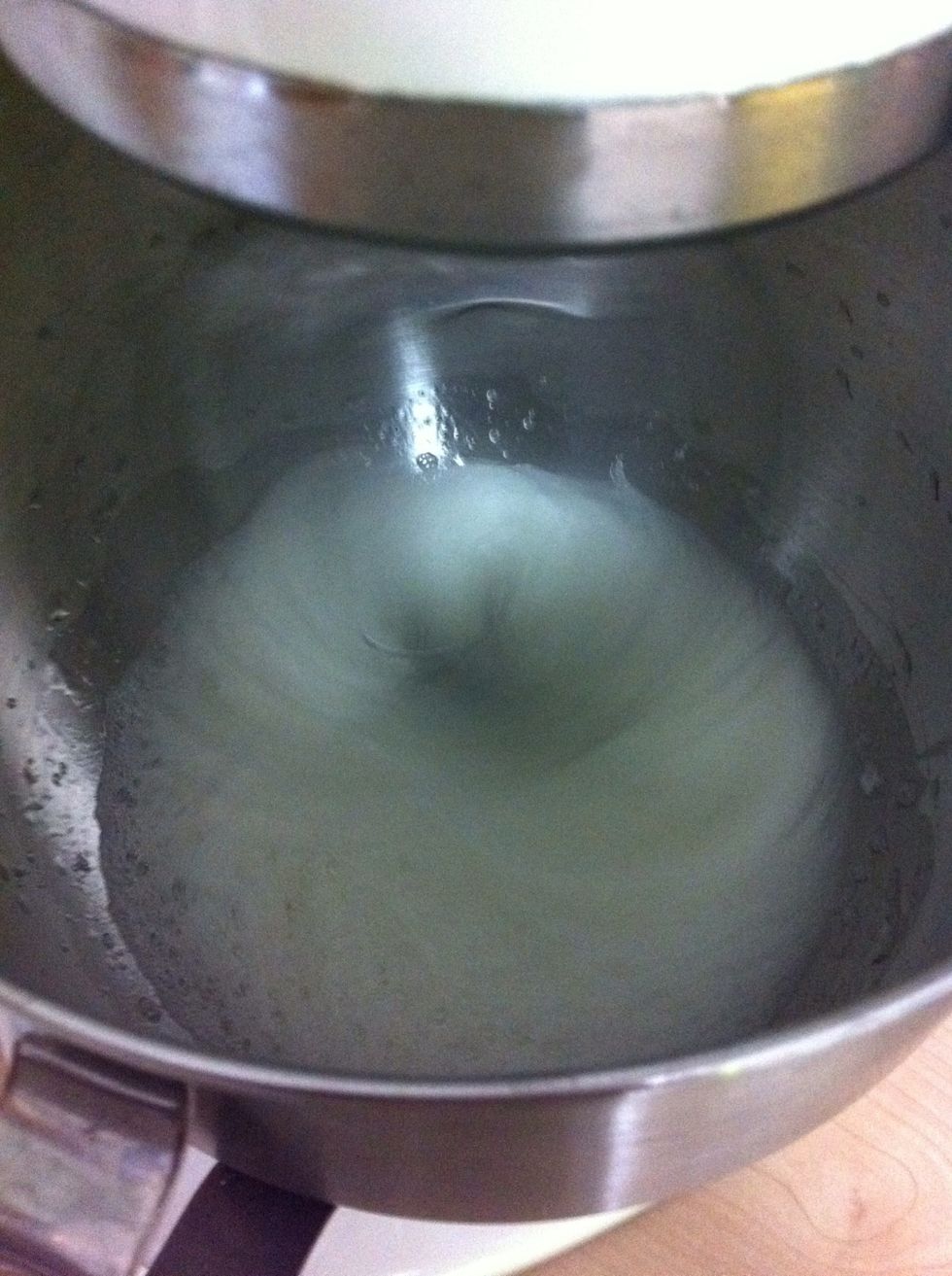 Beat room-tenperature egg whites with lime on medium speed until foamy