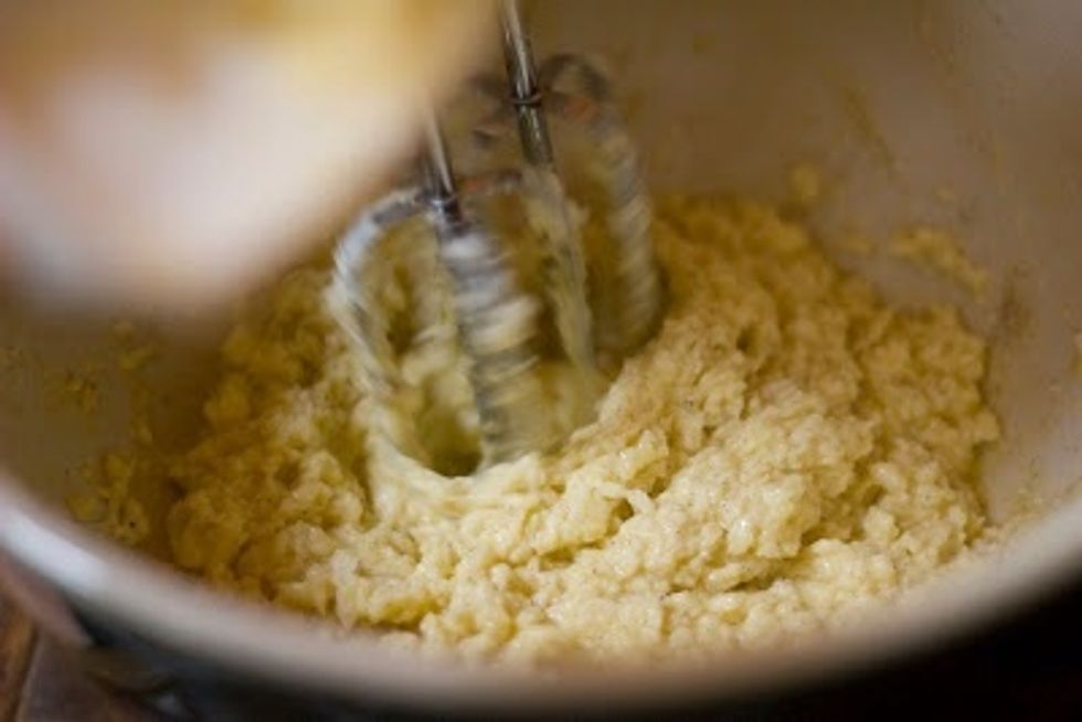 Beat the butter and the sugars together until it's all light and fluffy.