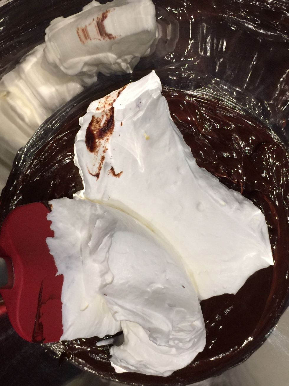 Beat the cream and fold in the chocolate mix. If you are using dark chocolate, you might want to add some icing sugar into the cream