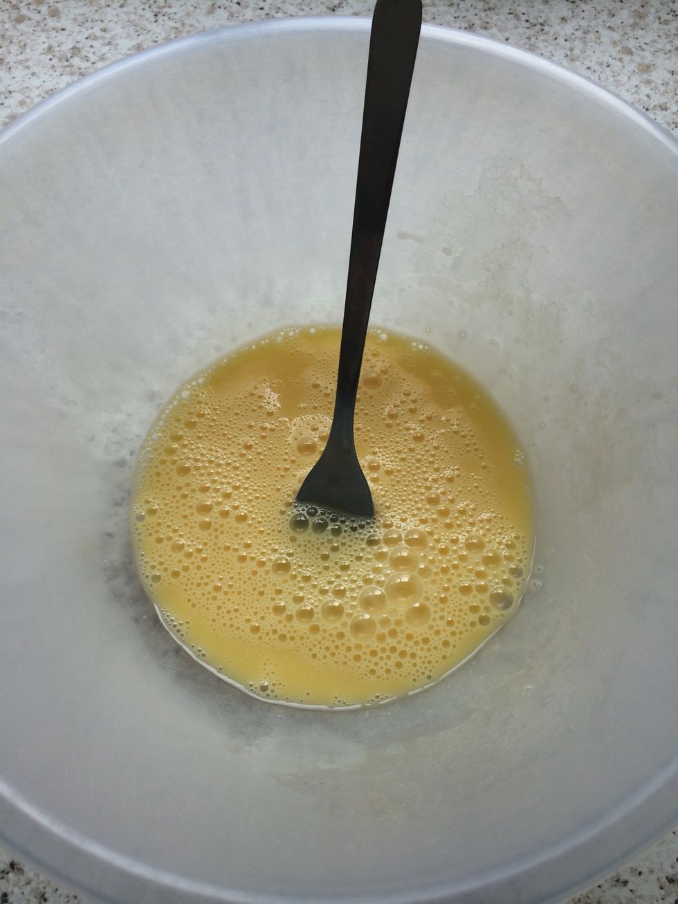 Beat the eggs in a bowl.