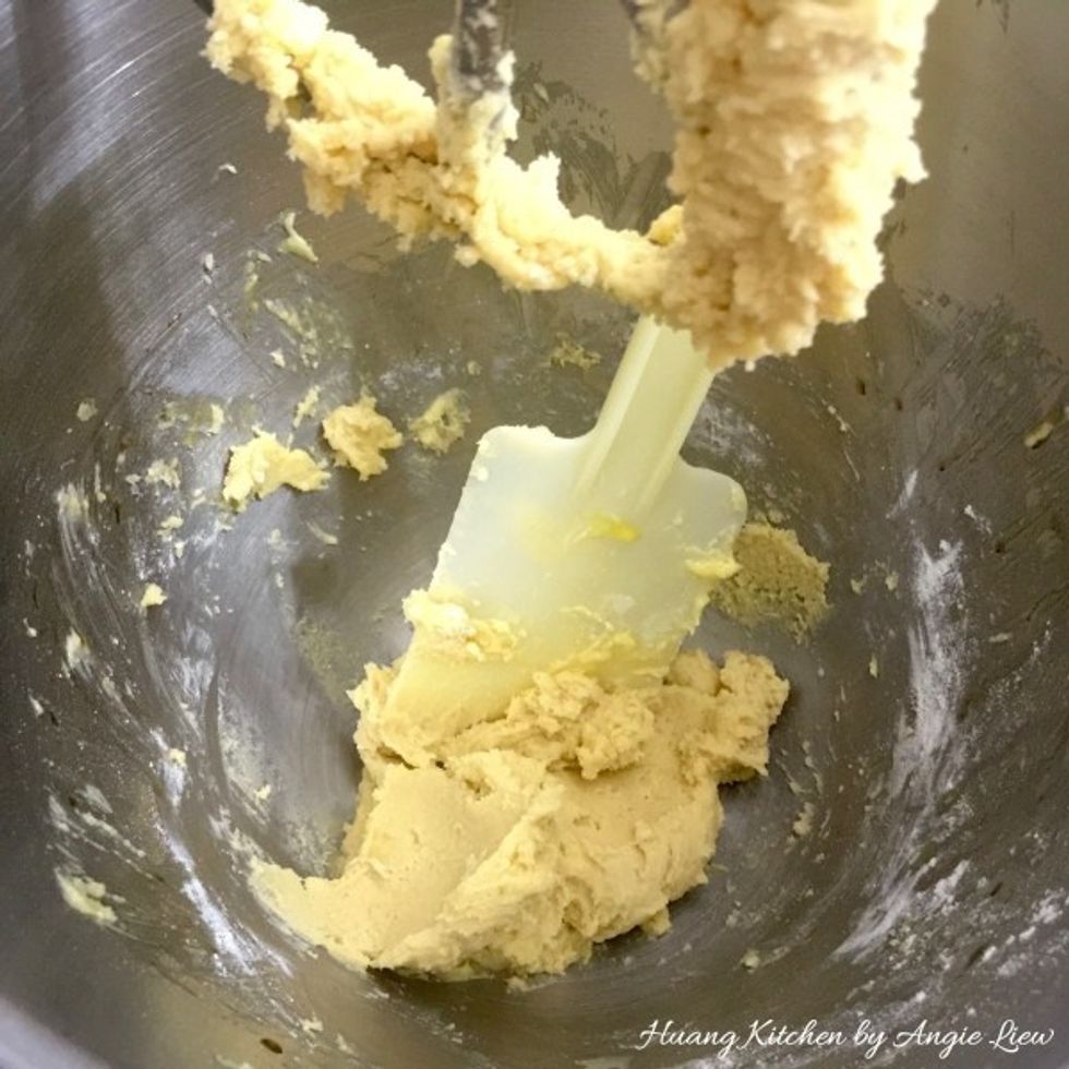 Beat the flour mixture until a batter is formed. Scape down the sides. And we're done with the cookie dough.