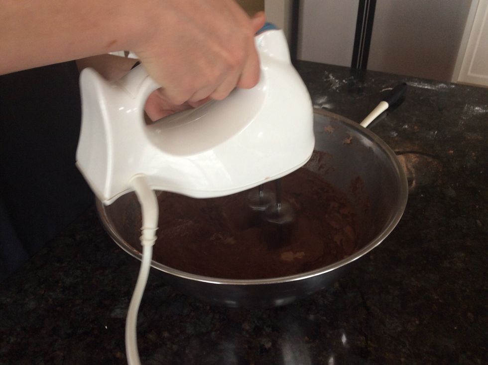 Beat the mixture in the large bowl on the lowest speed and steadily increase the speed as the mixture becomes more fluid and the same throughout.