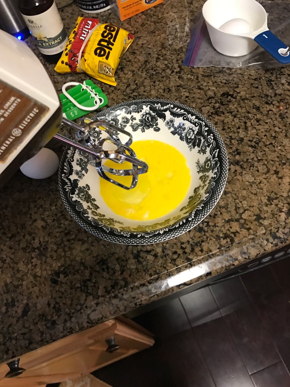 Beat the two eggs together for one minute, the add them to the brown mixture previously made