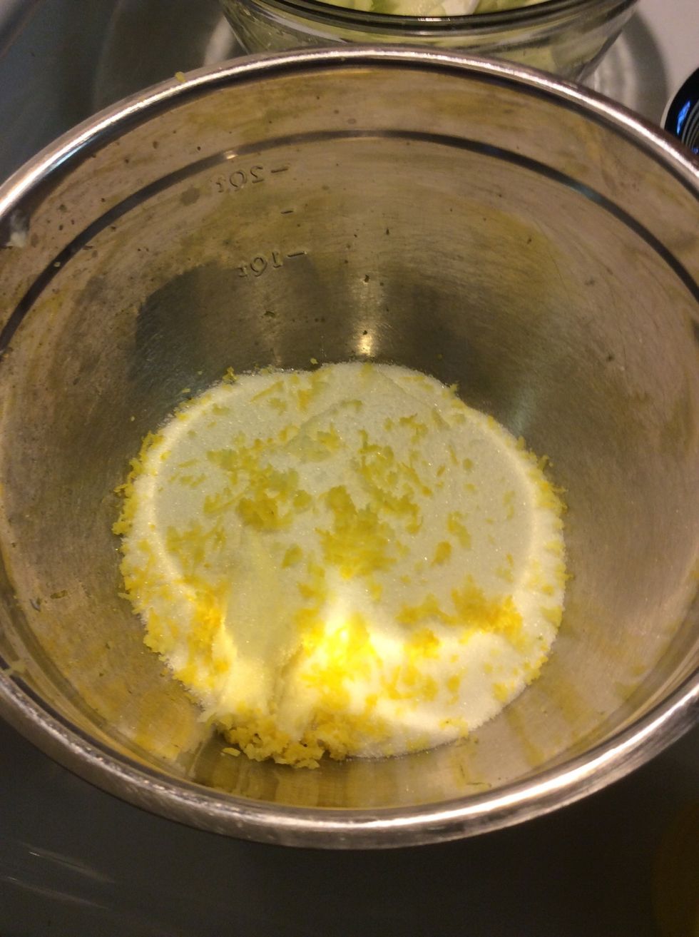 Beat together butter, lemon rind, and all but 1 tablespoon of the sugar until light and fluffy