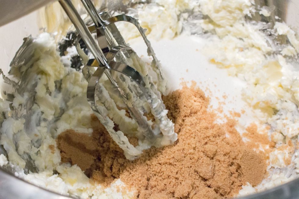 Beat together butter, shortening, and brown & white sugars.