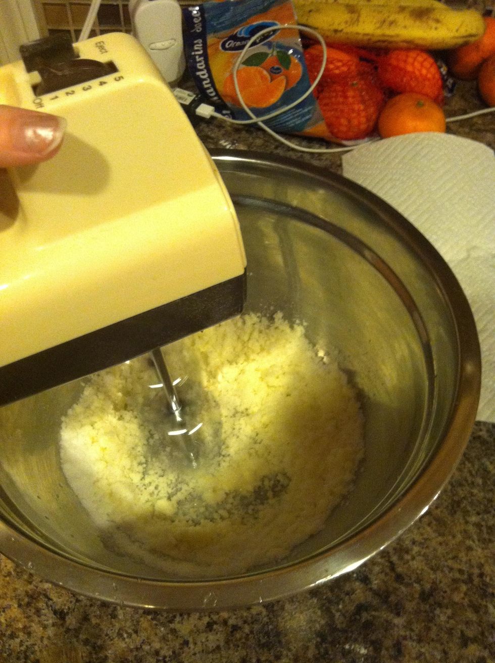 Beat together the butter and sugar on a medium speed until light and fluffy, approximately 1 minute.