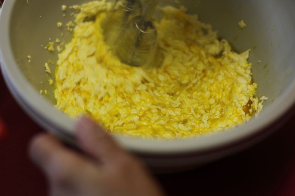 Beat until the mix becomes like curd and continue to mix... You can add the flour, coconut that is on your deli paper to this