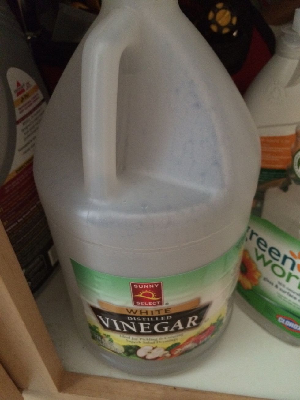 Because I like a little extra power i add about a half a cup of vinegar. This ensures that your floors are getting disinfected. Another option is a capful of bleach but that will dry wood floors.