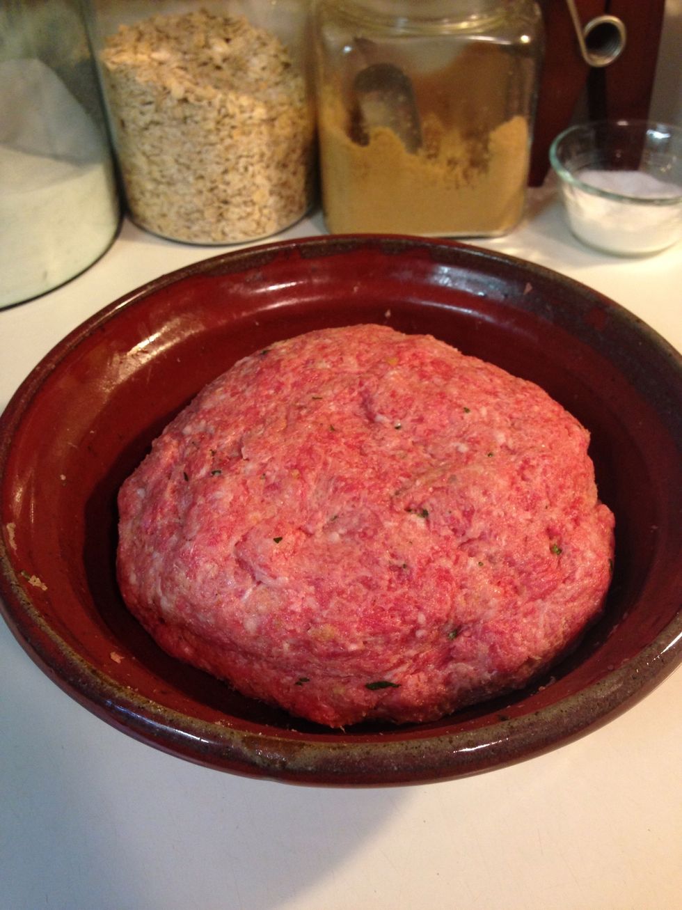 Beef and pork have a slightly different color. Mix until you have a pretty uniform color throughout the mixture. You don't want any one ingredient clumped into one particular section.