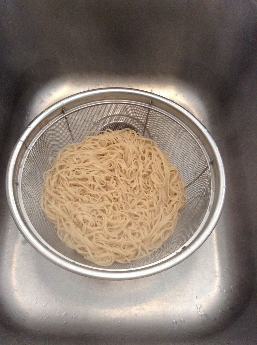"Beep Beep", pasta is done & drain into colander in sink. Drain well!