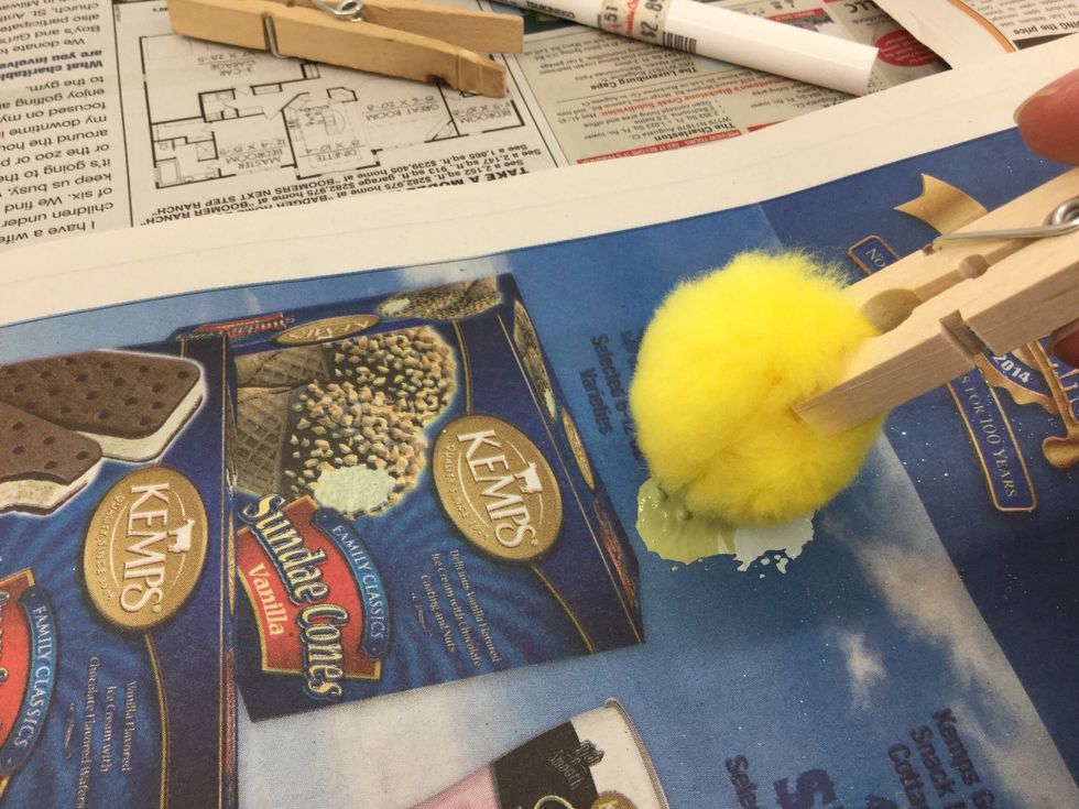 Before adding paint to the bowl, remove some of the excess paint by tapping it in your newspaper covered work surface.