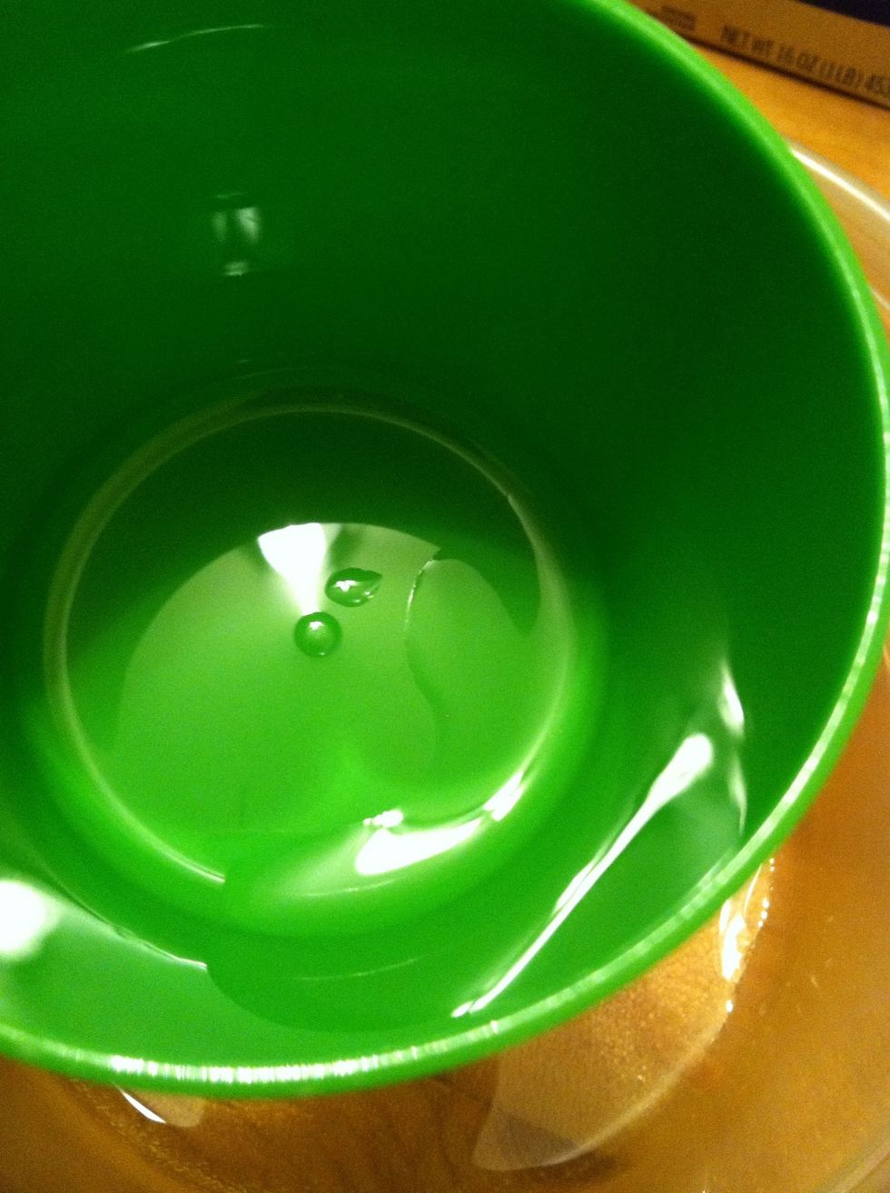 Before adding the glue, grease up your measuring cup with some baby oil.