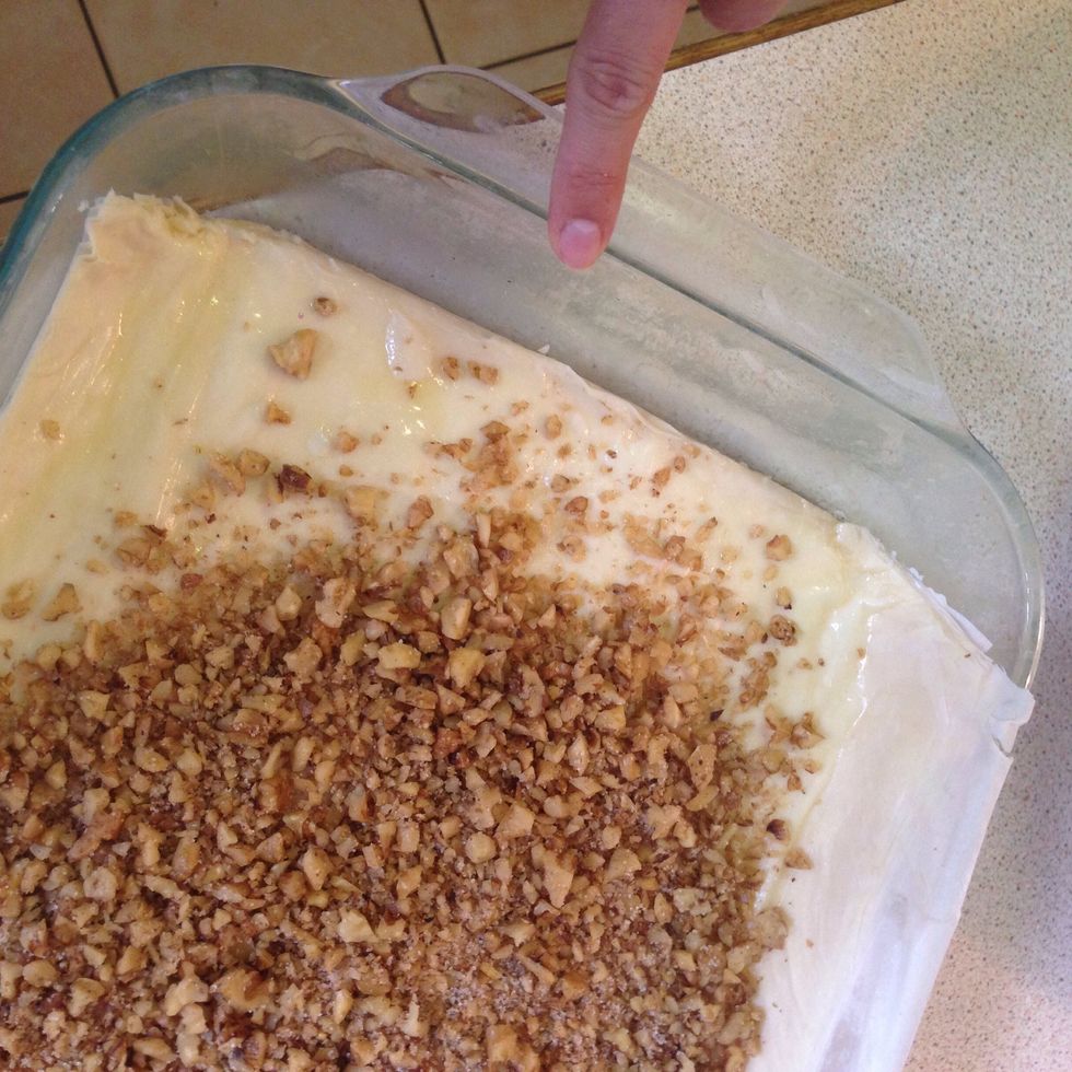 Before adding the nut mixture, use a knife to carefully trim off the extra FILO dough. (Ignore the nuts in this picture, I accidently jumped ahead of myself!)