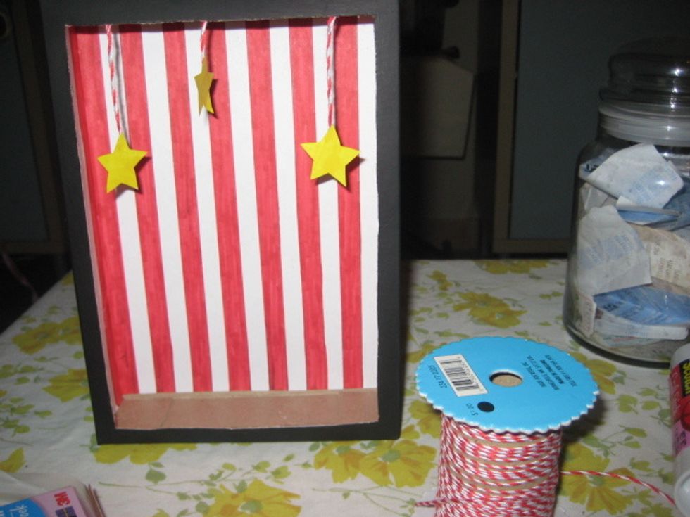 Before adding the plastic I wanted to add this stars for nice decoration. I glued the starts to string and then attached then with adhesive dots.