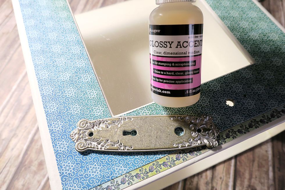 Before attaching the door plate to the box, add a bit of glossy accents to the back side of it. The glue will keep it securely in place, once fully dry.