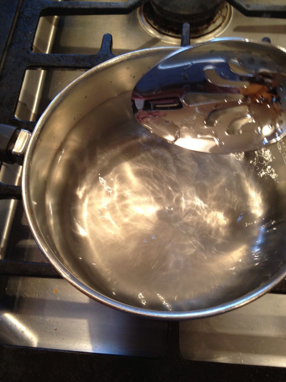 Before dropping in the egg, stir the water to make a little whirlpool. That will keep the egg together in the middle.