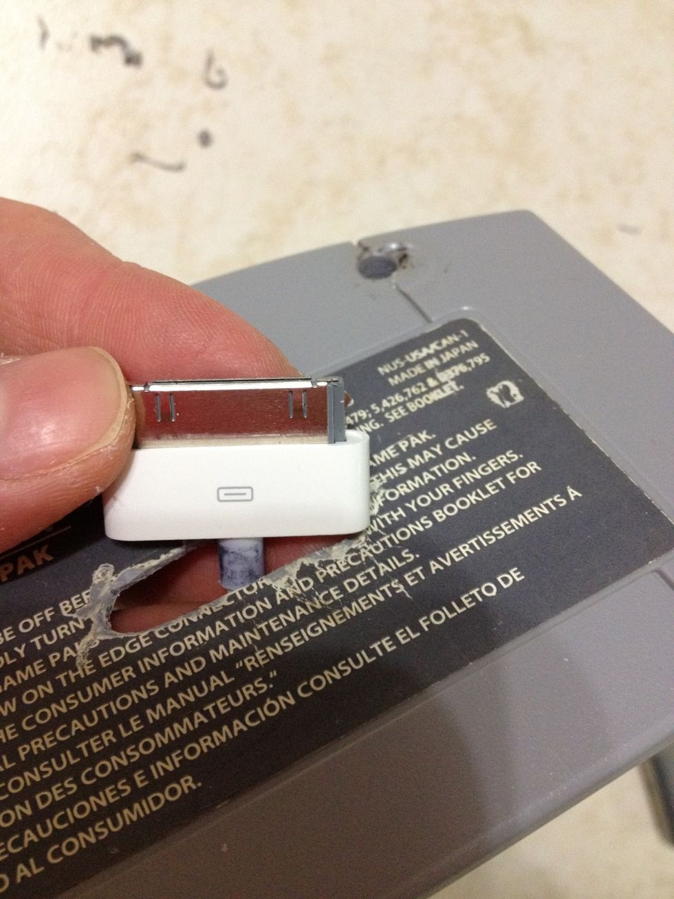 Before gluing the USB in place, make sure the cord is facing the correct way. Glue the USB securely to the cut out. Be careful not to get any glue on the metal of the charger.