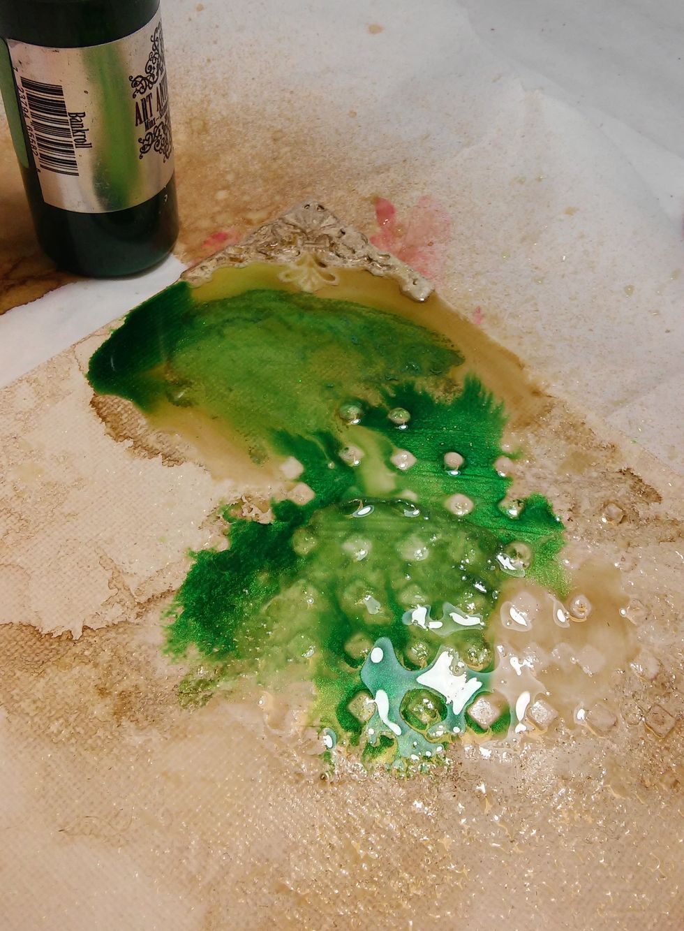 Before it dries I used a couple drops of Bankroll Minx Ink. It gave a gorgeous two tone color effect...as well as shimmer from the minx. Now I'll dry the with my heat tool.