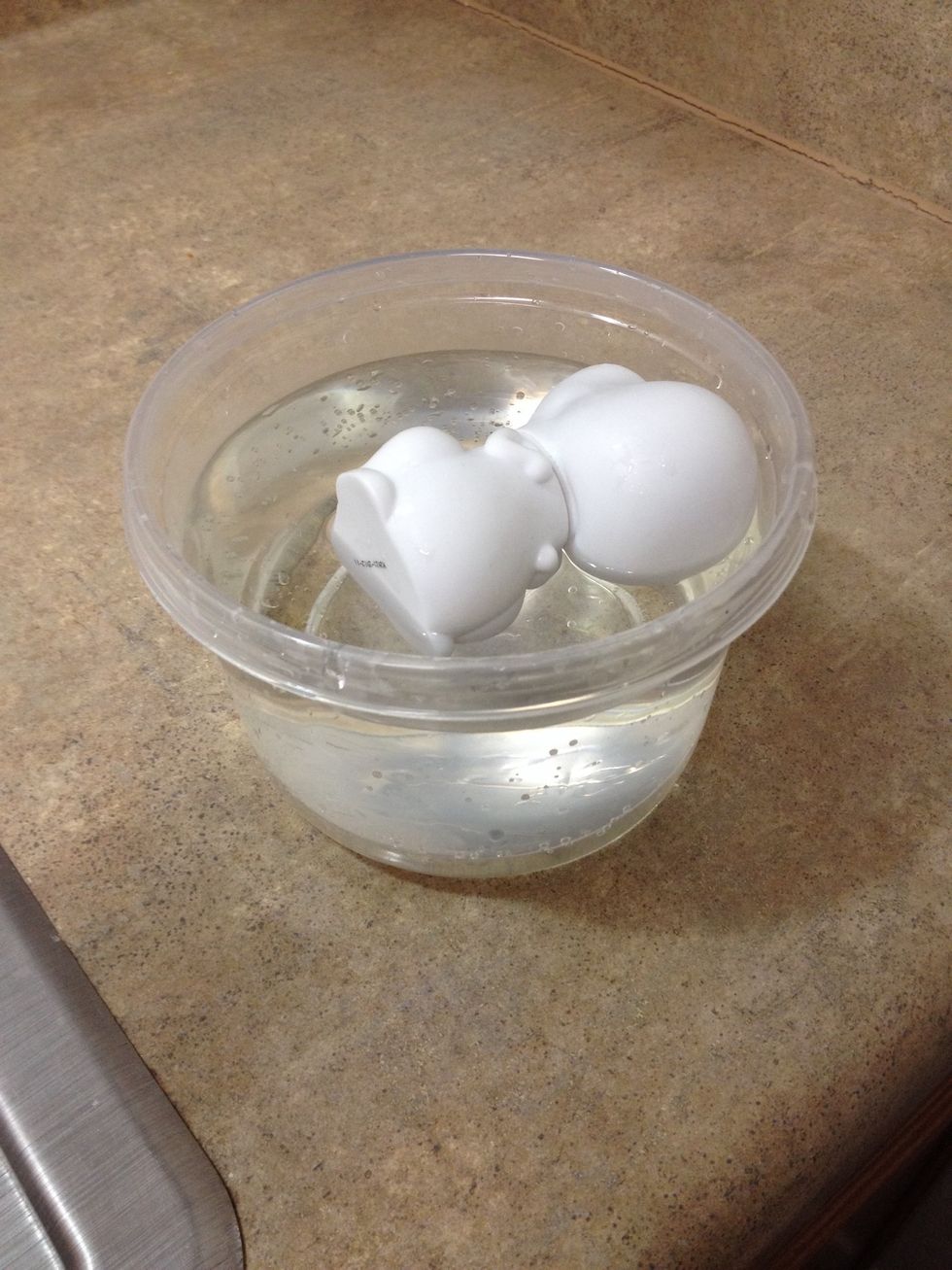 Before painting or glueing anything on your toy it's a good idea to clean it in warm water and a little bit of soap to wash off any dirt or oils from handling